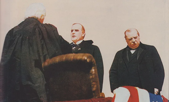 Chief Justice Melville Fuller administering the oath to McKinley as president in 1897. Outgoing president Grover Cleveland stands to the right.
